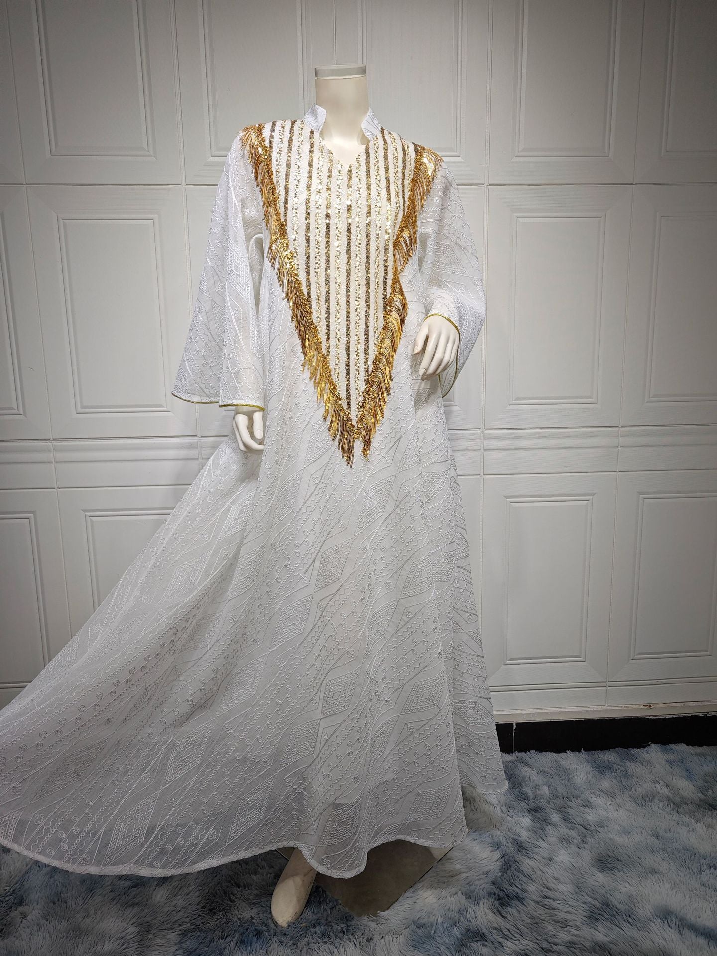 HS6648 A long robe with mesh sequins and embroidered details; an elegant and sophisticated dress.