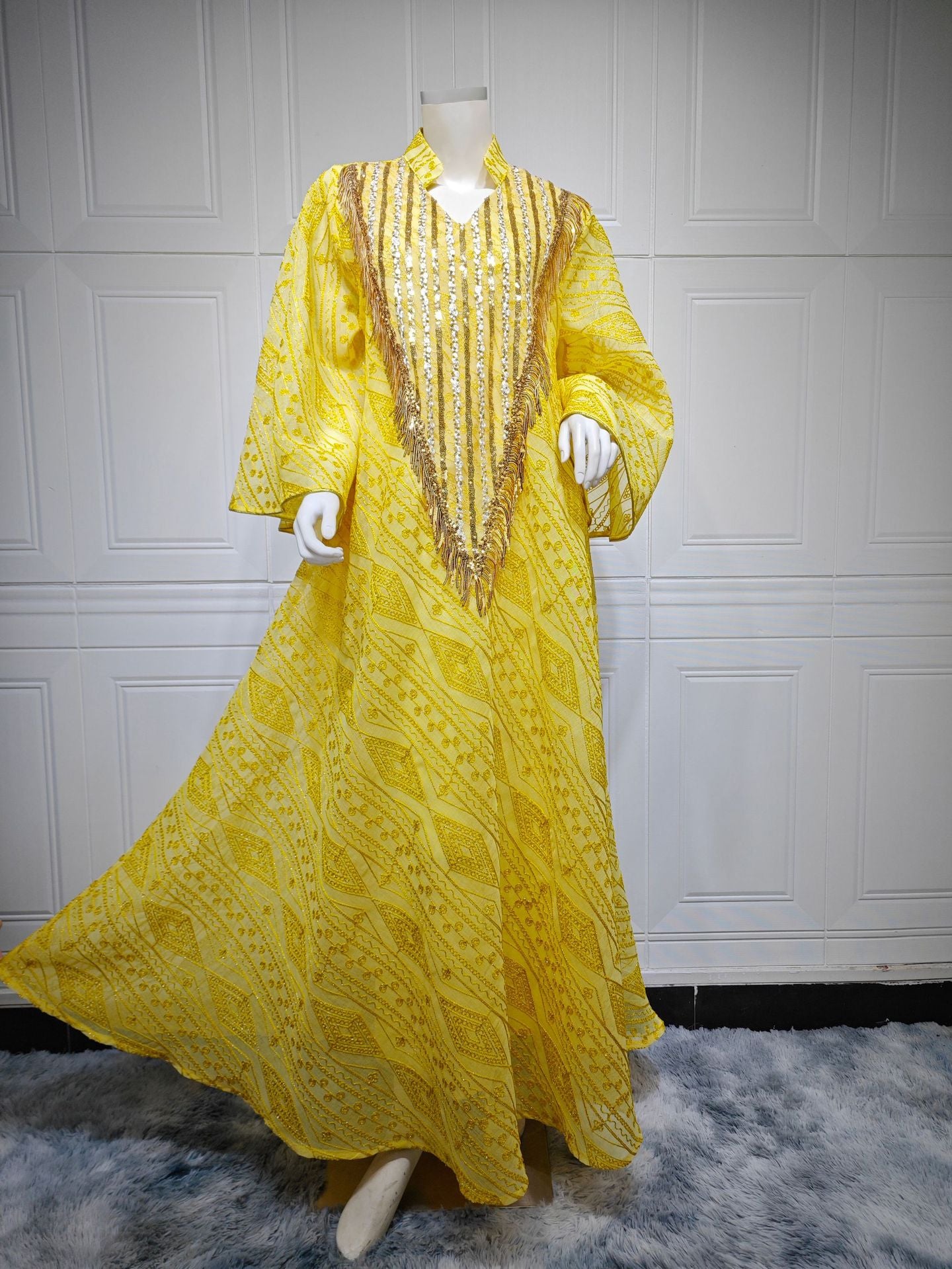 HS6648 A long robe with mesh sequins and embroidered details; an elegant and sophisticated dress.