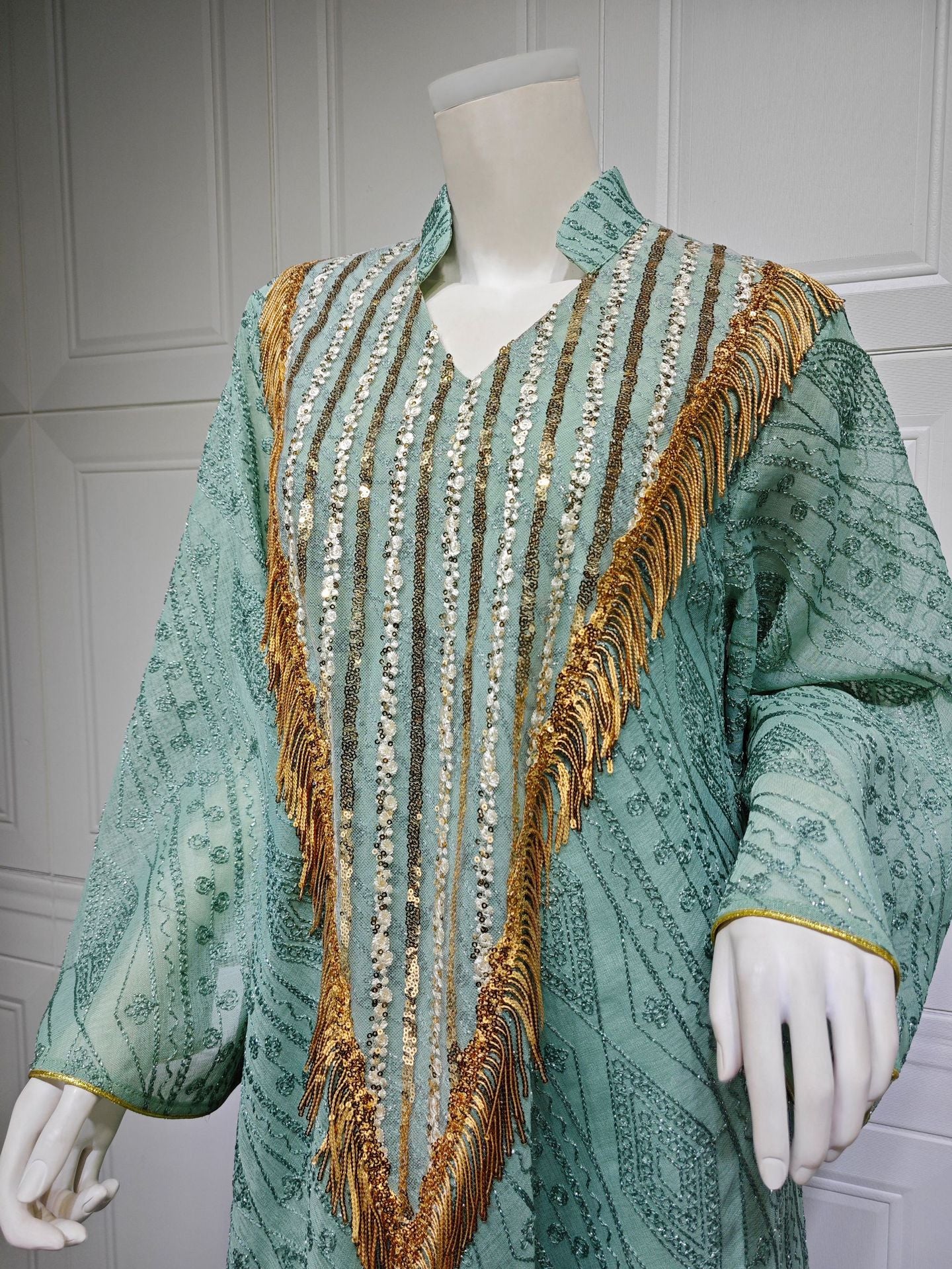 HS6648 A long robe with mesh sequins and embroidered details; an elegant and sophisticated dress.